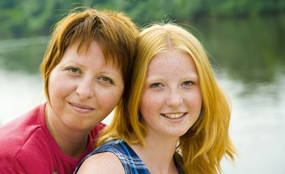 mother and teenage daughter outdoors